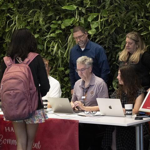 A family registers at Commencement.
