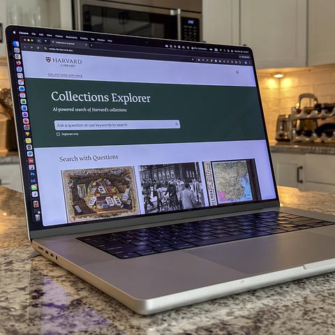 Laptop with the homepage of the Collections Explorer displayed on its screen.