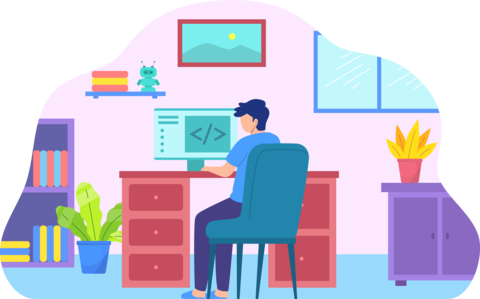A person sits at a desk while coding on their computer.